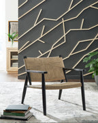 Accent chair with black wooden frame and arms, natural woven seat and backrest