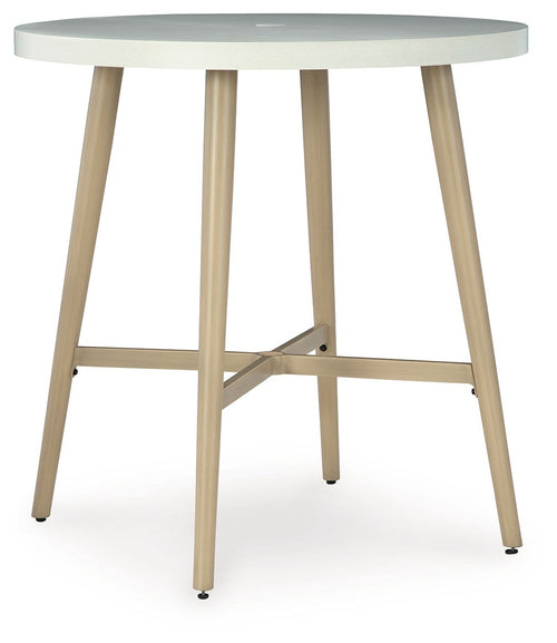 Beige round bar table with cross-brace support, four tapered legs