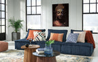 Navy modular sectional sofa with chaise and patterned accent pillows