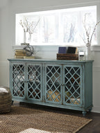 Vintage teal accent cabinet with four lattice-front doors and metal knob pulls