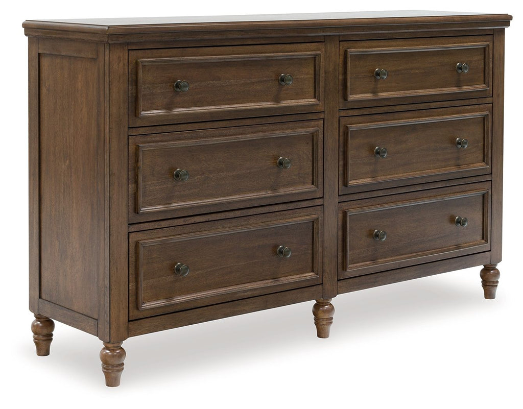 Brown wood dresser with six drawers and round metal knobs, shaker-style panels