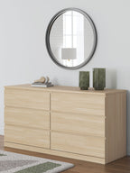 Light brown six-drawer dresser with flat-panel drawers and no visible handles