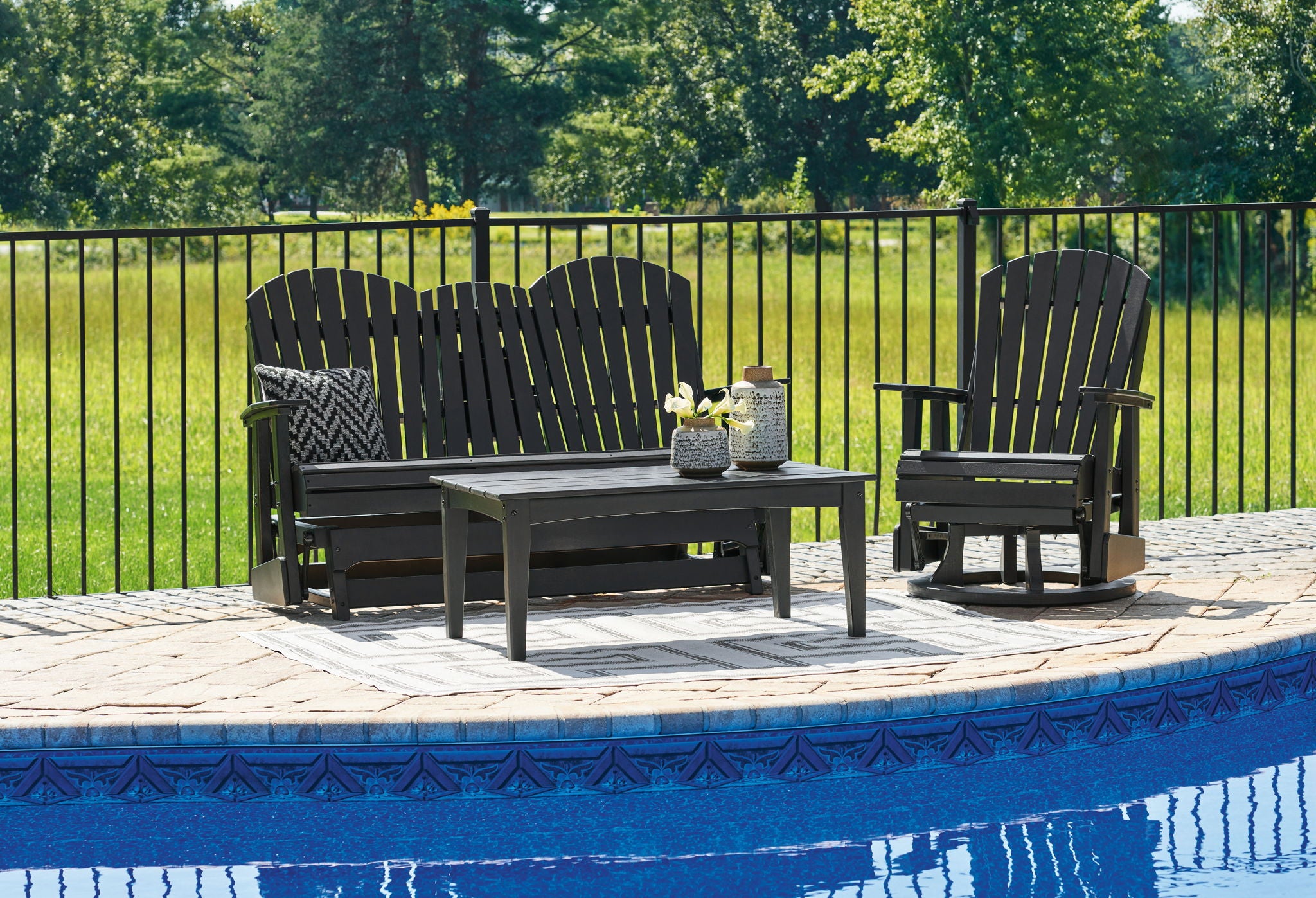Outdoor patio seating set with two chairs and a small square table