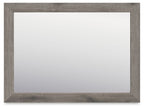 Rectangular bedroom mirror with gray-brown frame and clear reflective glass