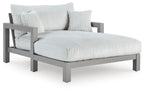 Gray chaise lounge with striped seat cushion and folded back cushion set
