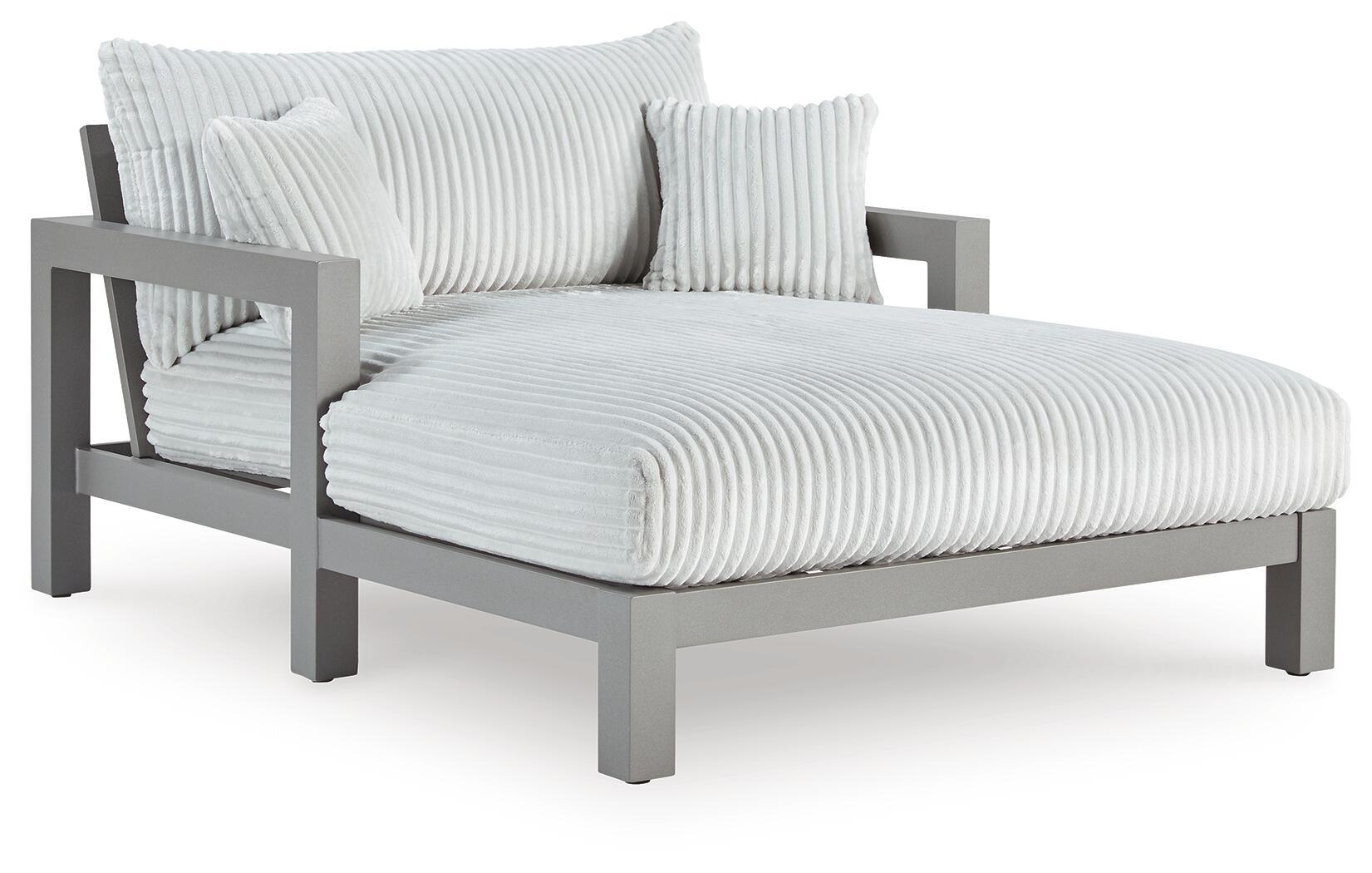 Gray chaise lounge with striped seat cushion and folded back cushion set