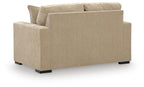 Light tan upholstered loveseat with two back cushions and wide arms