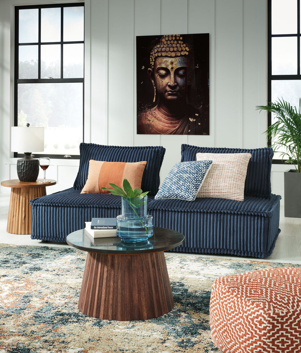 Navy modular sectional sofa with chaise and decorative pillows, corner-like layout