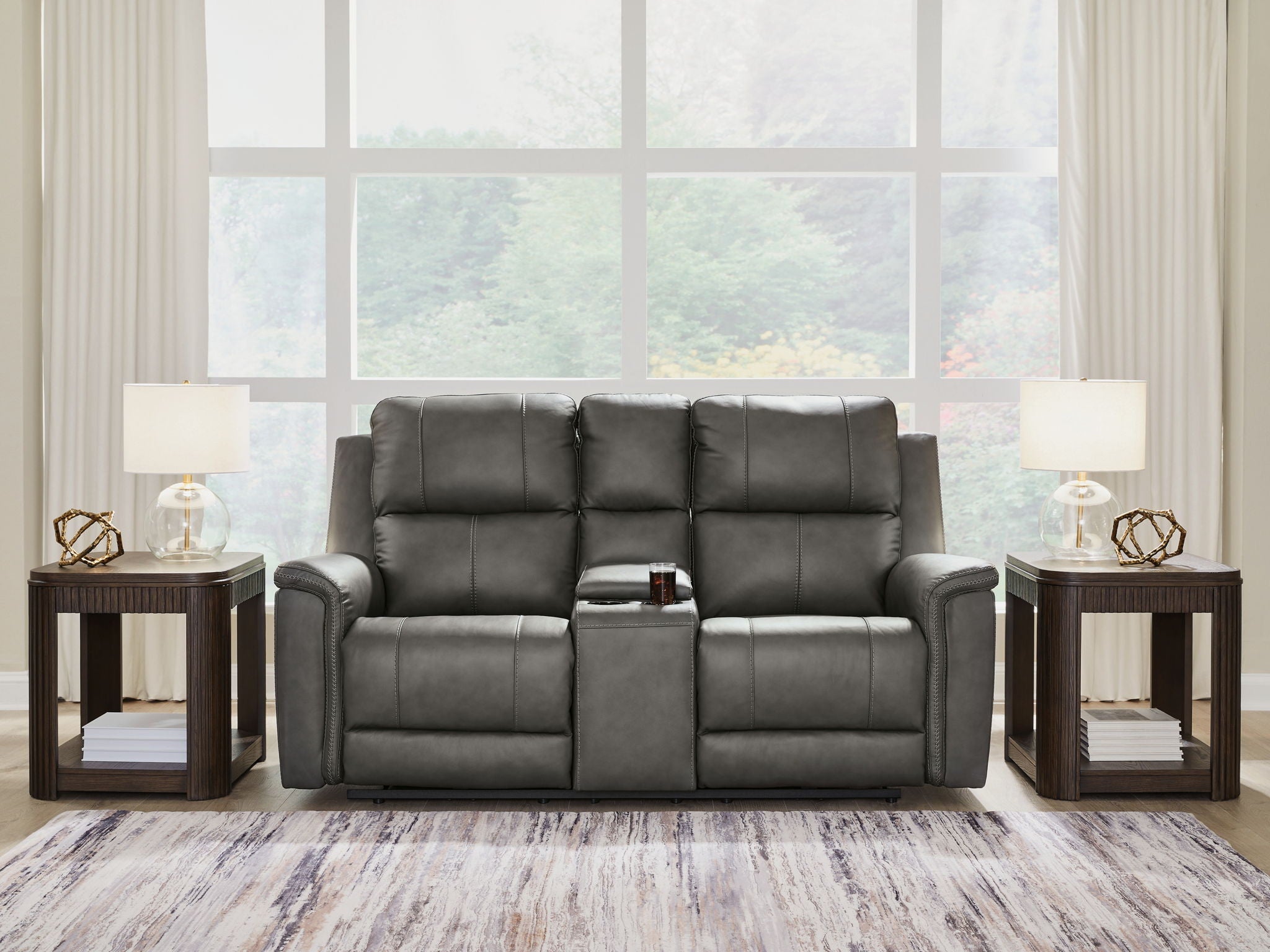 Power reclining loveseat with console, gray upholstery with adjustable headrests and center detail