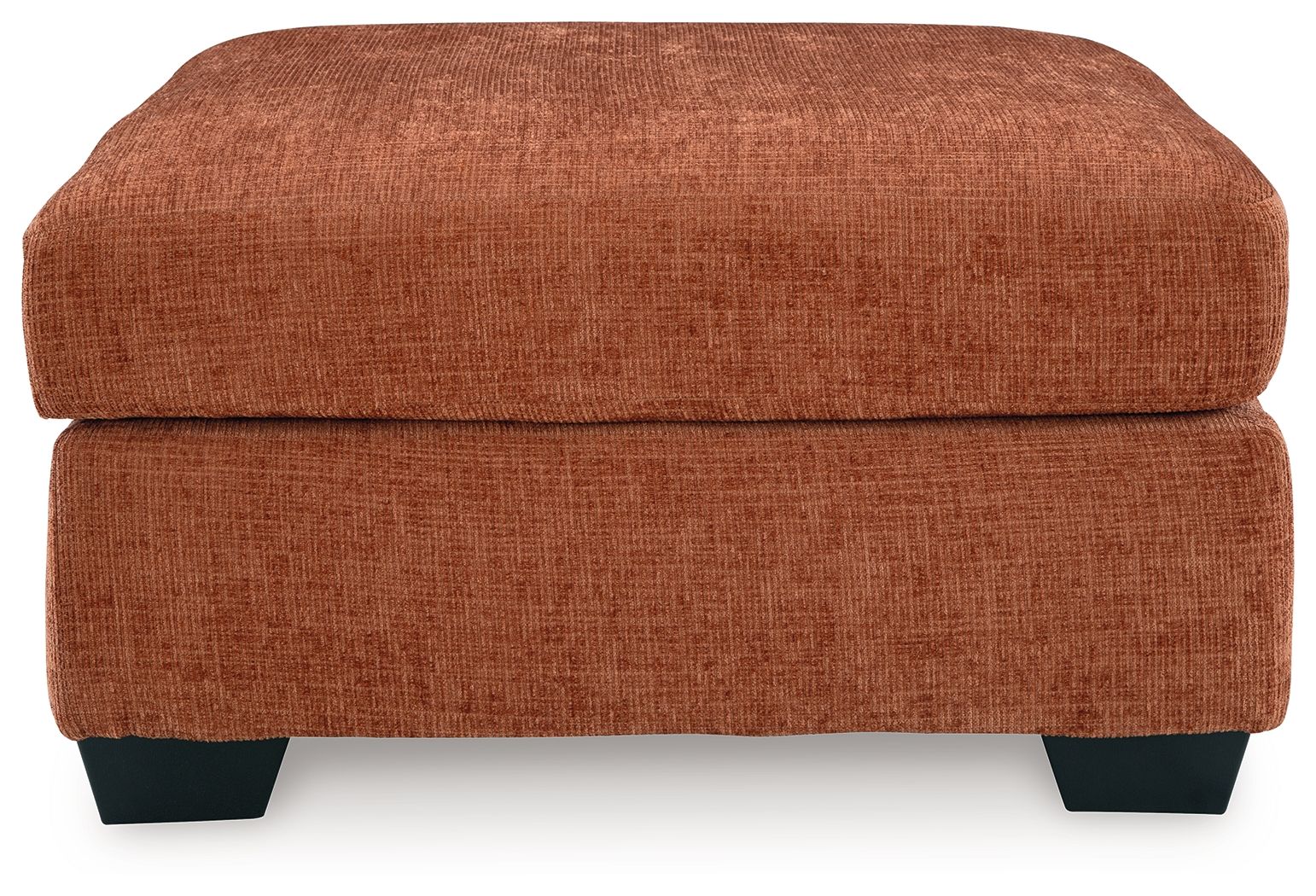 Rust-colored upholstered accent ottoman with square top and dark legs.