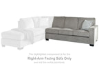 Right-arm facing gray upholstered sofa with chaise extension and accent pillow