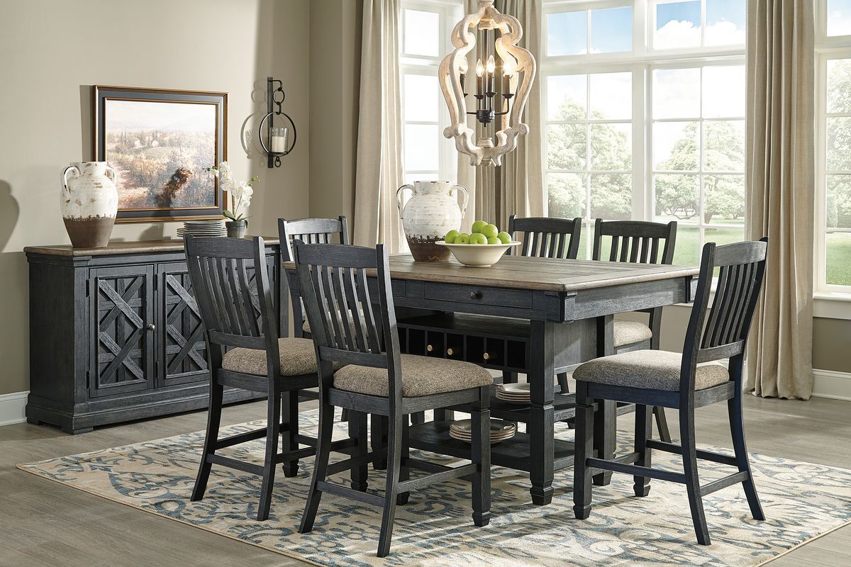 Dark gray counter height dining table with four slat-back bar stools and side cabinet