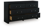 Black six-drawer dresser with angled view of drawers and silver bar handles.