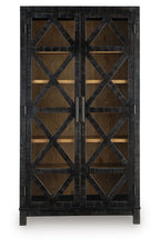 Black accent cabinet with X-pattern door fronts and interior shelving
