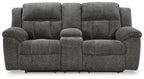 Dark gray double reclining loveseat with central headrest and tufted seat cushions