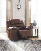 Dark brown power reclining armchair with padded arms and front footrest position