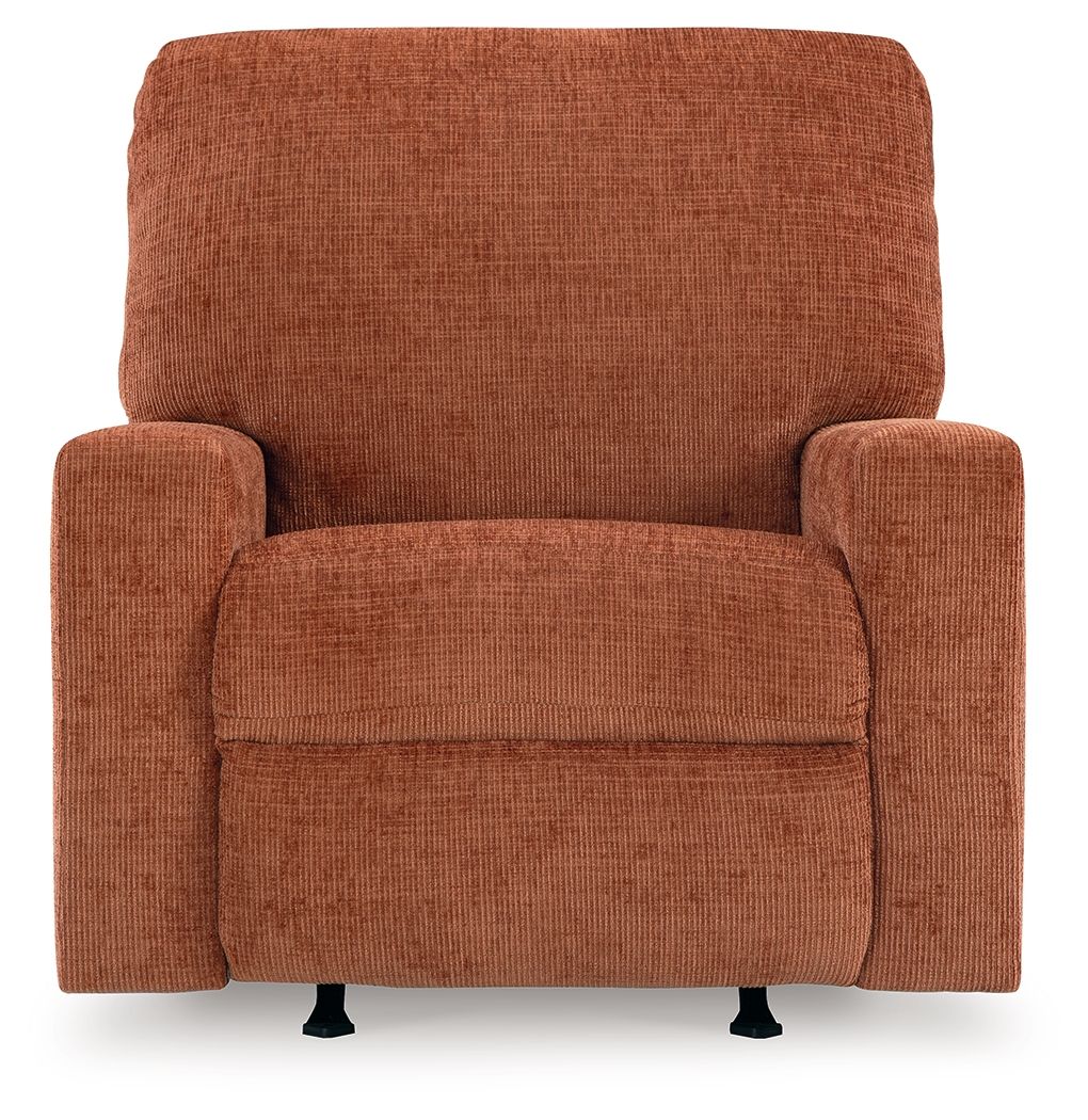 Rocker recliner chair in rust-orange upholstered fabric with centered seat cushion and arms.