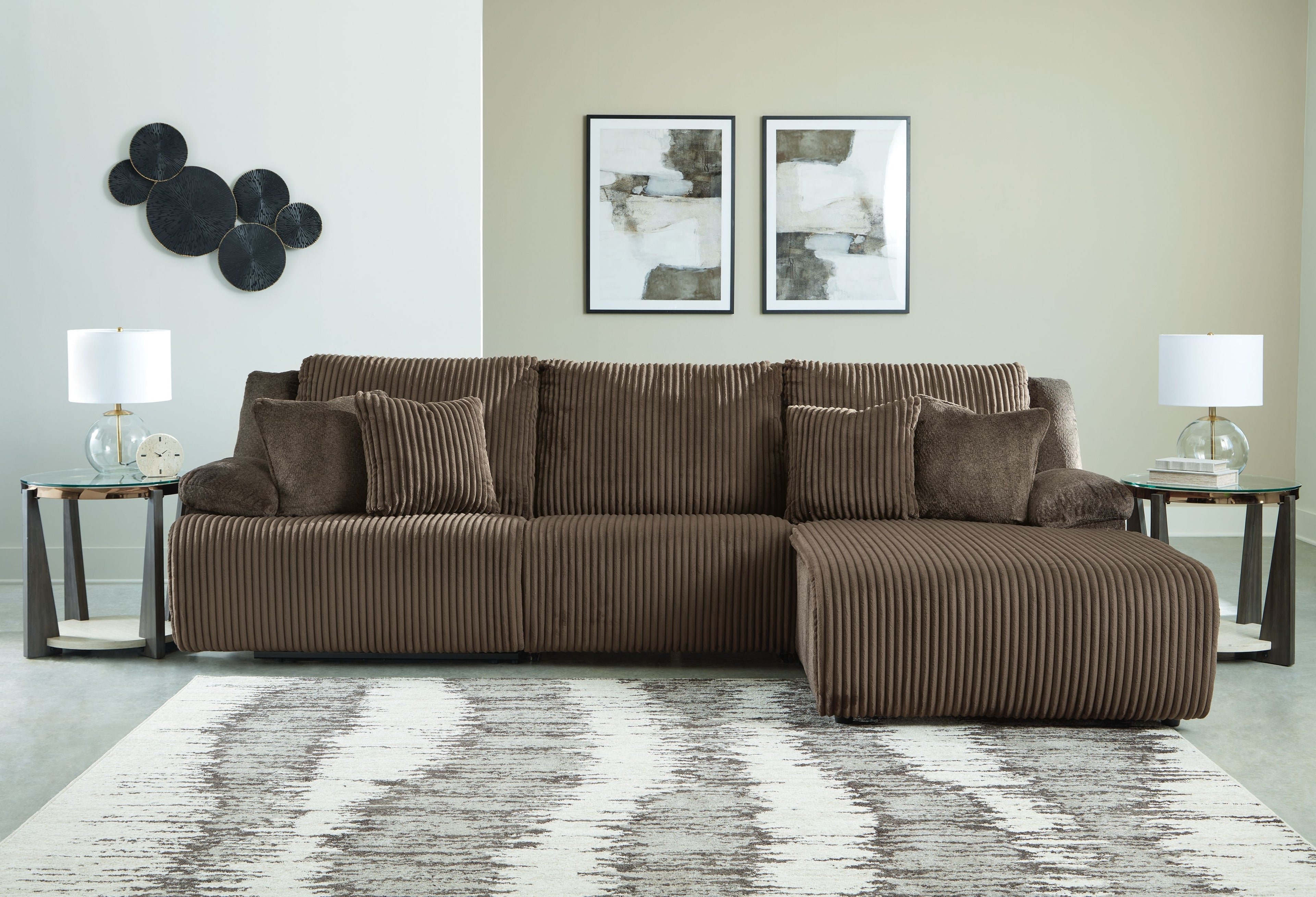 Chocolate brown reclining sectional sofa with striped upholstery and right chaise cushion