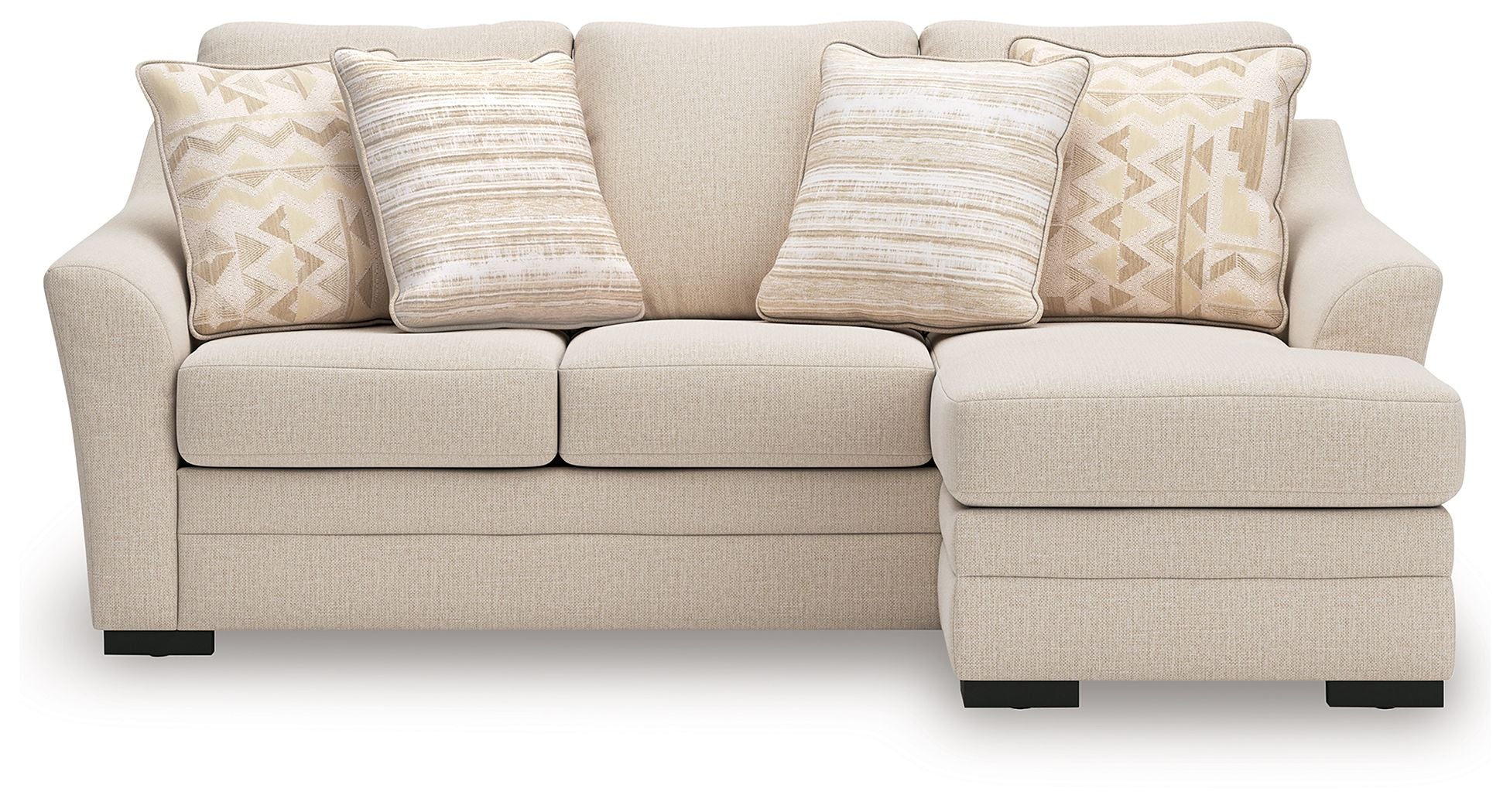 Light beige sofa chaise with three seat cushions and decorative jute-pattern throw pillows.