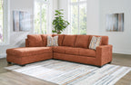 Rust-brown fabric sectional sofa with corner chaise and patterned throw pillows