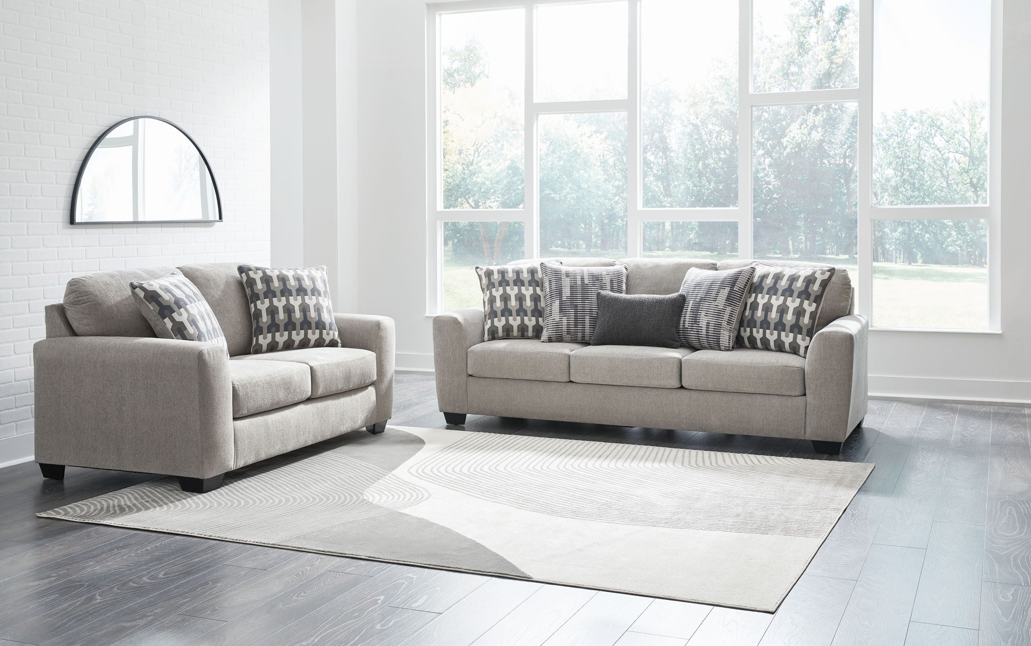 Gray living room seating set with two armchairs and a loveseat
