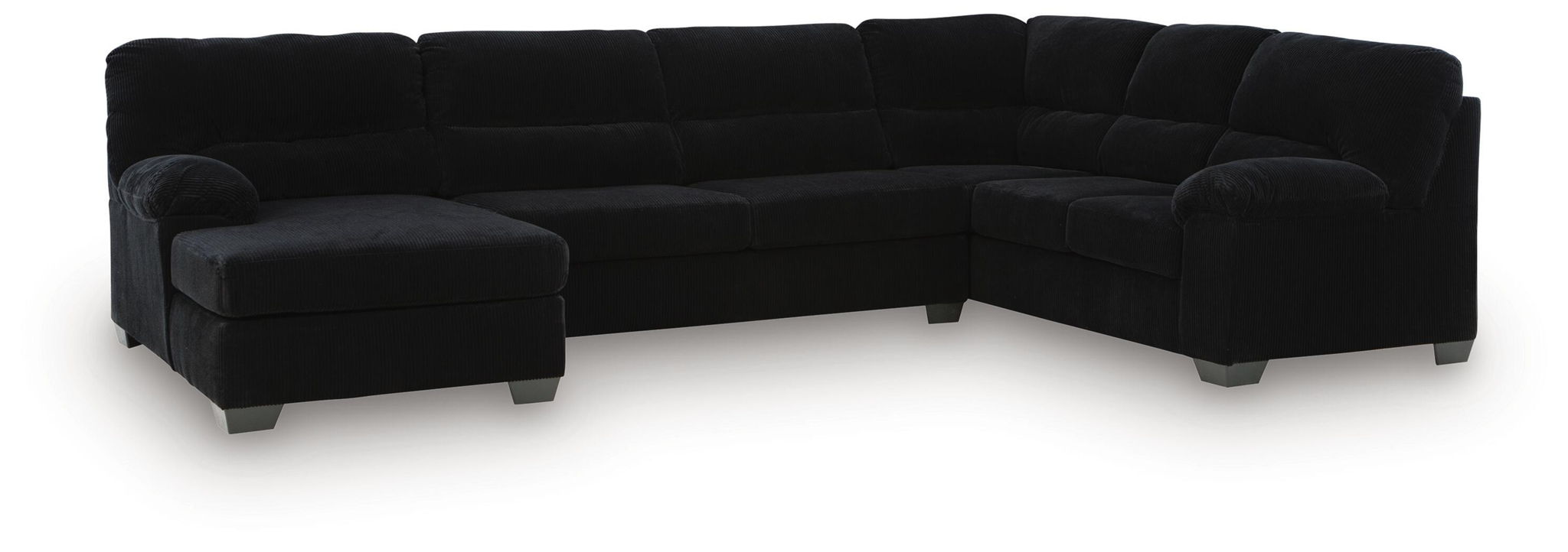 Black sectional sofa with corner chaise and tufted back cushions