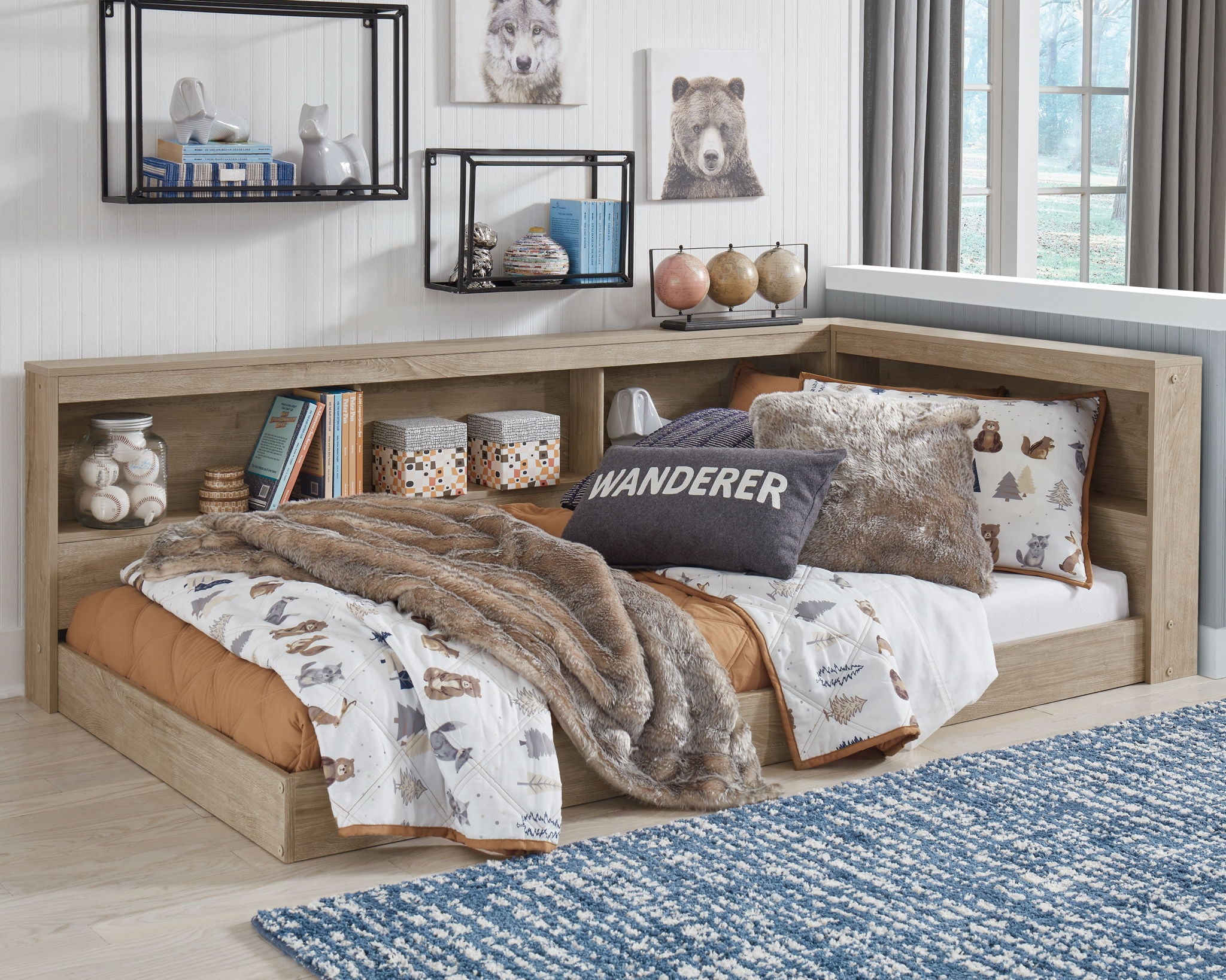 Beige bookcase storage bed with built-in shelves, styled with blankets and pillows