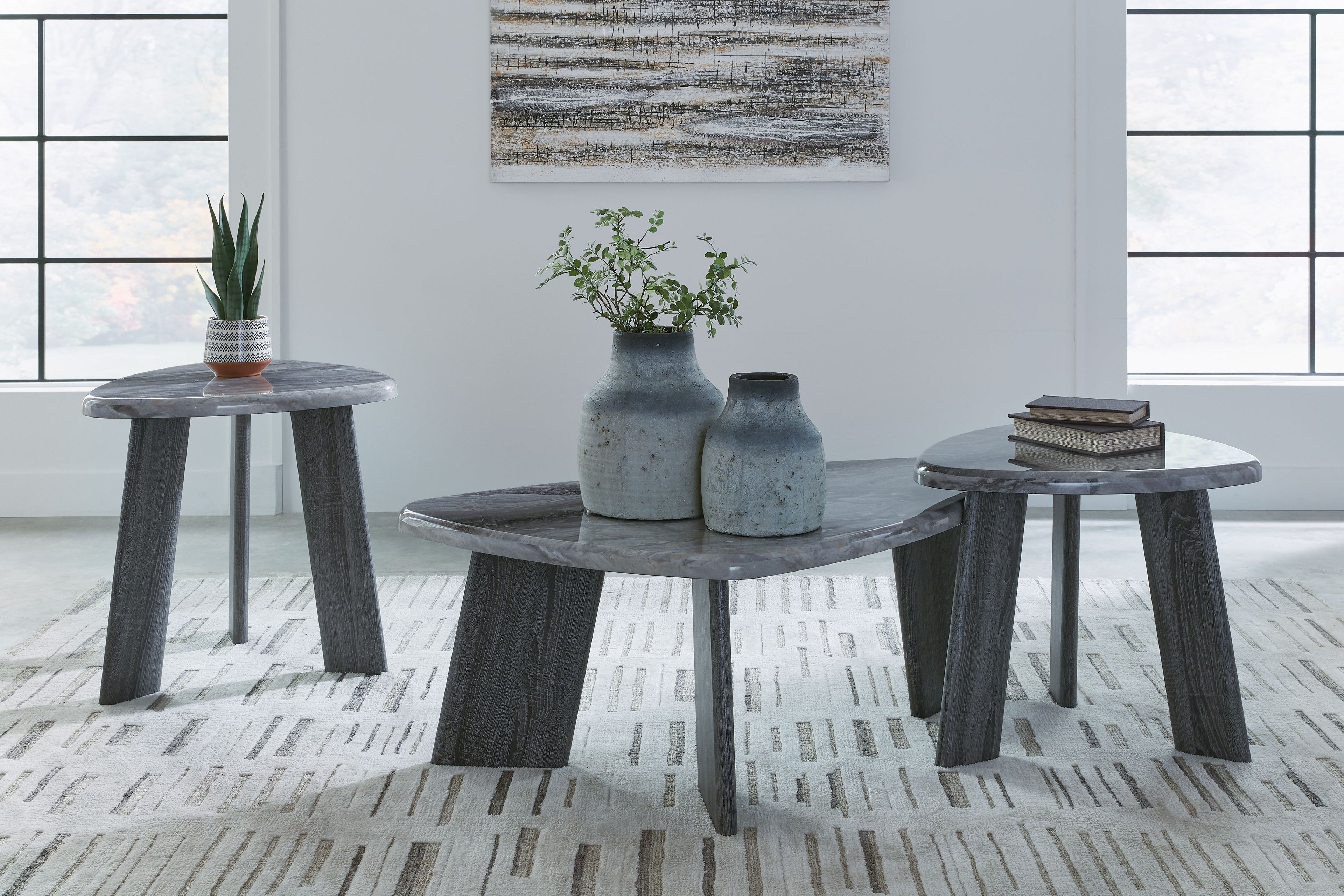 Set of 3 round gray occasional side tables with dark legs and speckled tops