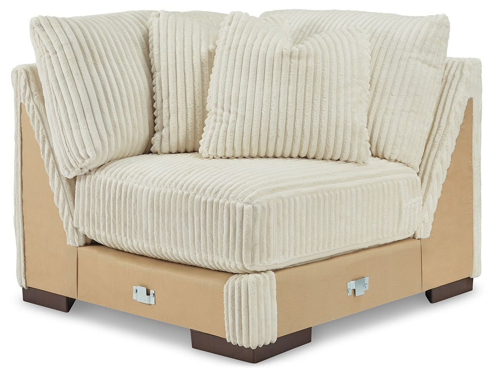 Ivory ribbed fabric wedge sectional chair with tufted back cushions