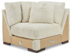Ivory ribbed fabric wedge sectional chair with tufted back cushions
