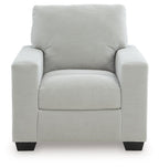Upholstered armchair with striped upholstery, cushioned seat and arms, and dark block legs.
