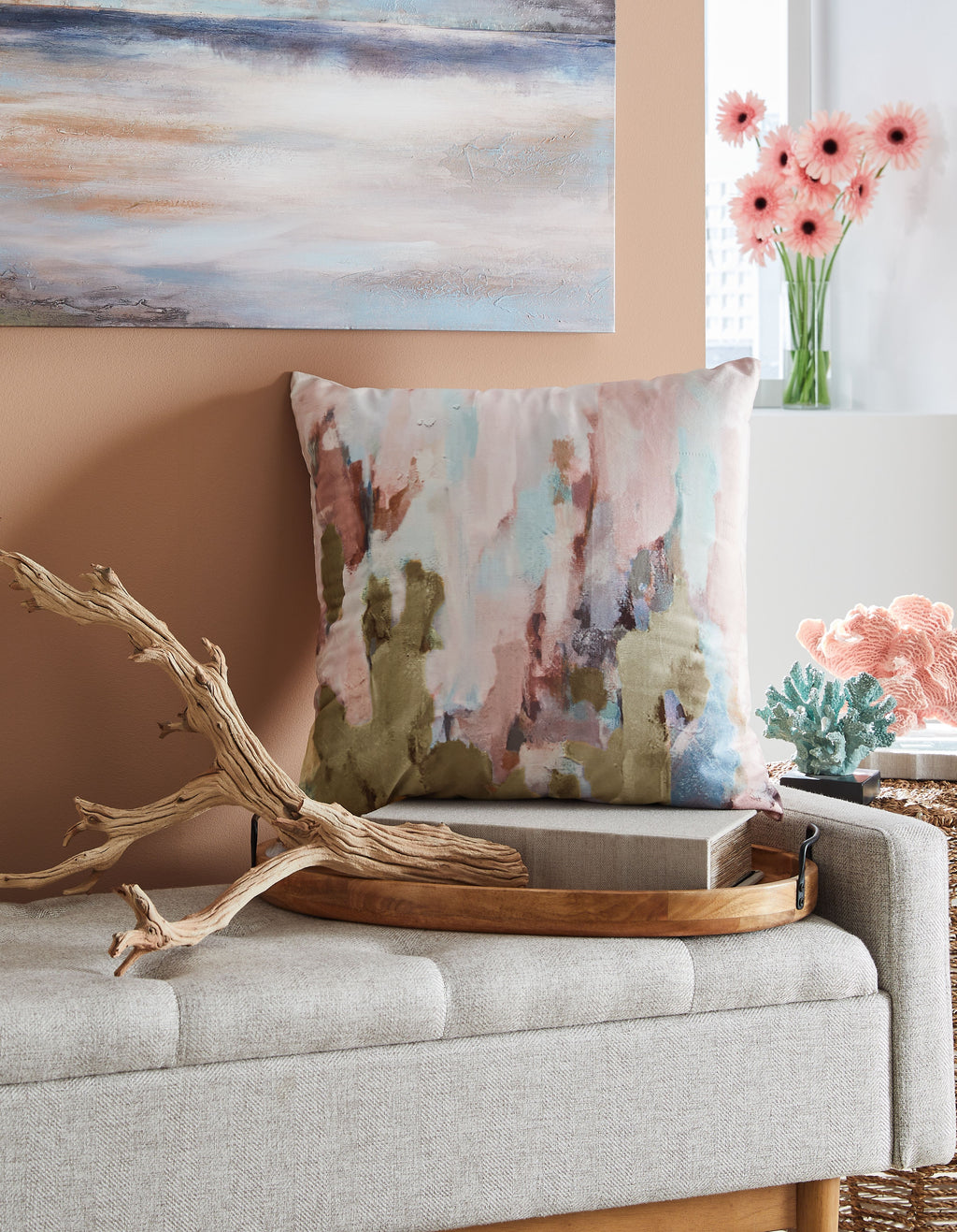 Abstract watercolor throw pillow with pink, teal, and tan blocks and soft pattern.