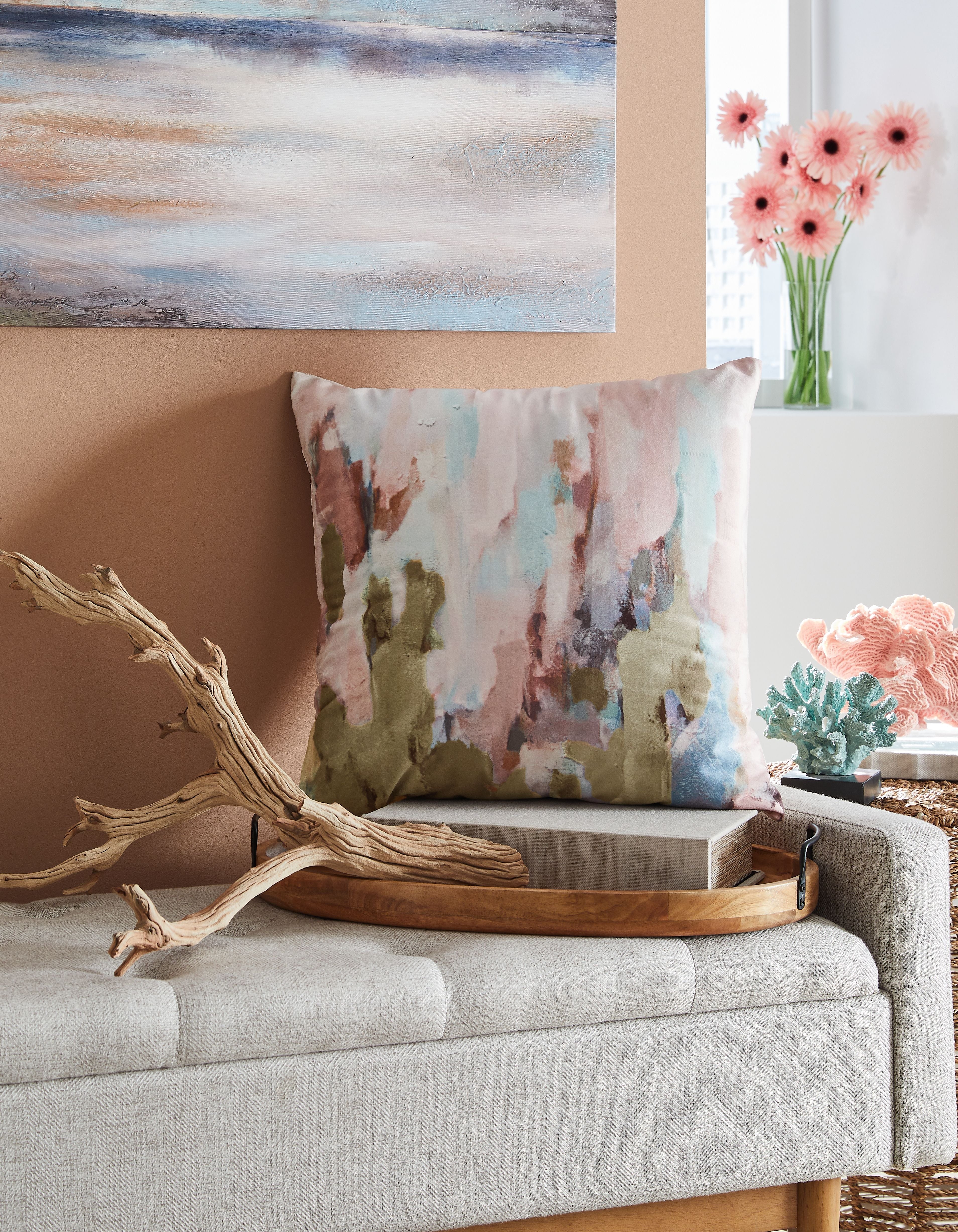 Abstract watercolor throw pillow with pink, teal, and tan blocks and soft pattern.