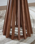 Round end table close view: warm brown legs and dark underside of round top