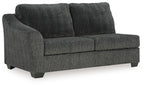 Dark gray upholstered sofa with boxy arms, two seat cushions and tall back.