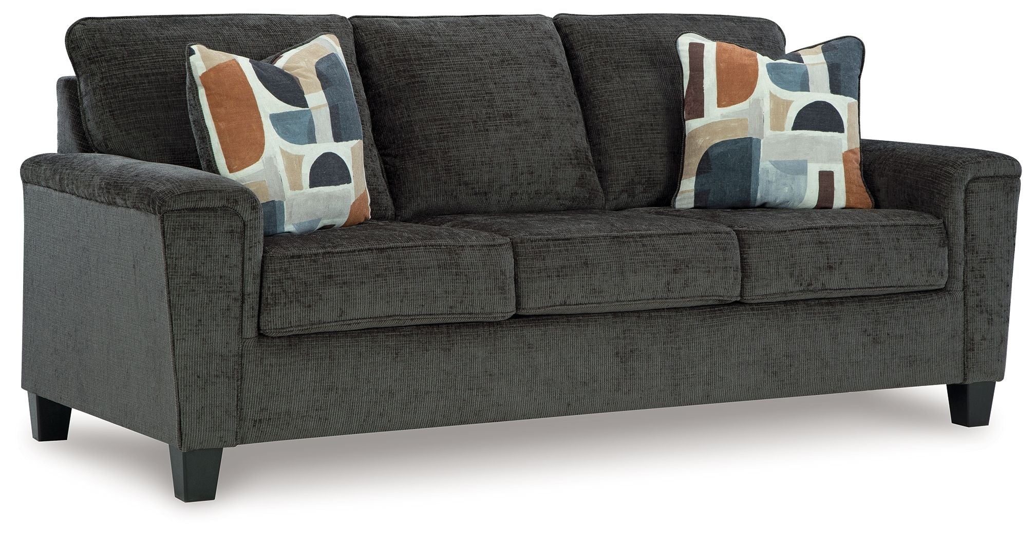 Dark gray sofa with three seat cushions and patterned throw pillows