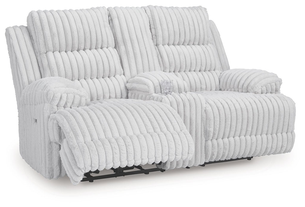 White channel-tufted double reclining loveseat with two chaise footrests and head cushions