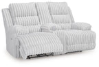 White channel-tufted double reclining loveseat with two chaise footrests and head cushions