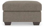 Triston-Peaks upholstered ottoman with rounded top, textured taupe fabric, dark legs