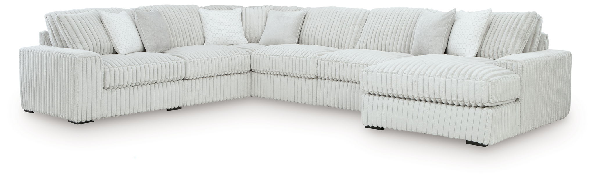 Sectional sofa with chaise, light-colored striped upholstery with padded armrests