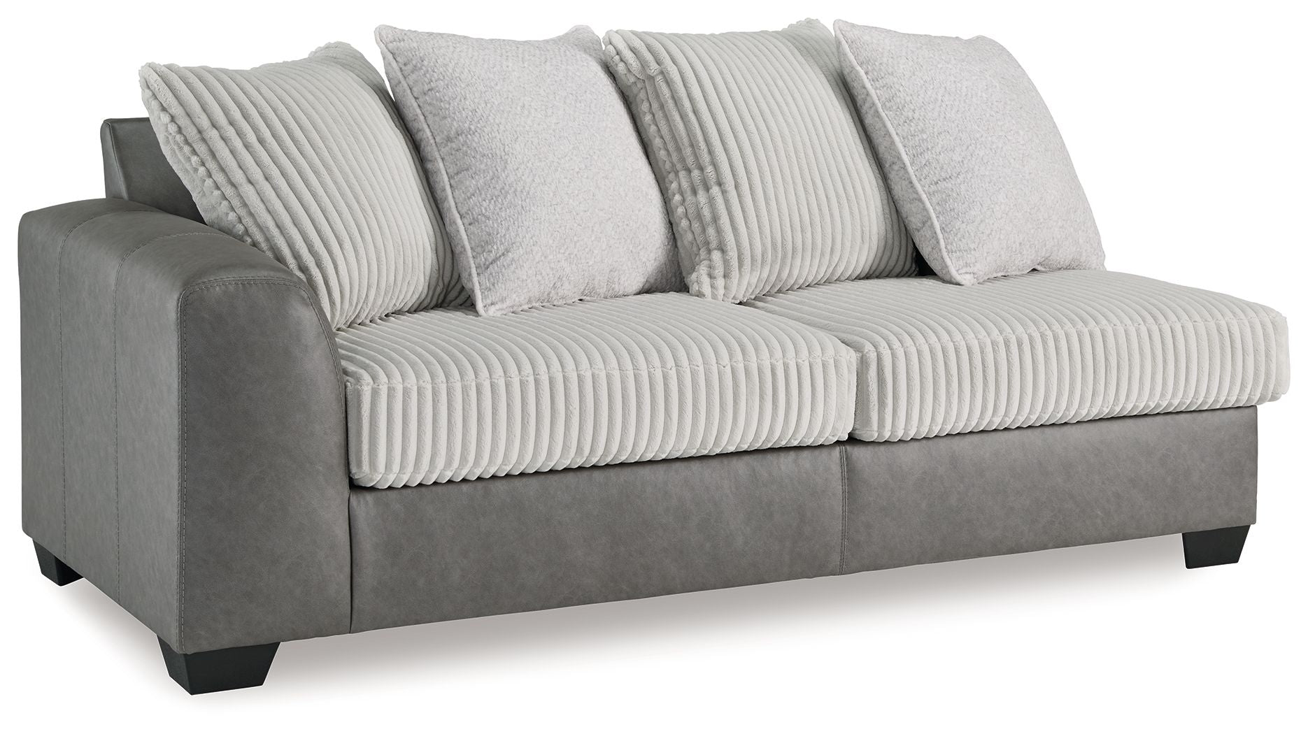 Grey upholstered sofa with ribbed front cushions and two light throw pillows