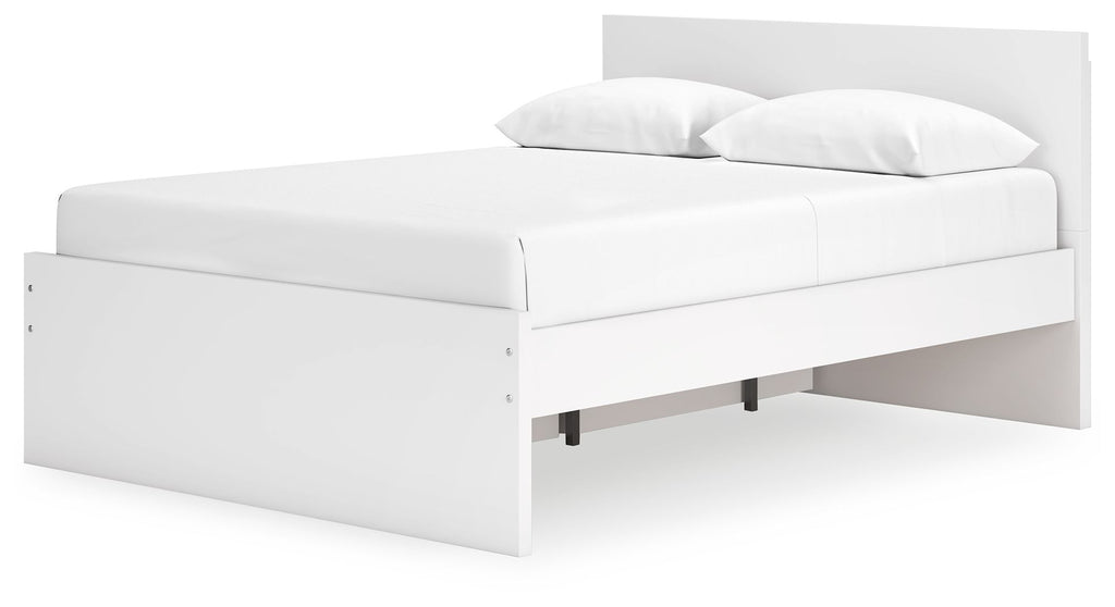 White panel platform bed with open storage area underneath and padded headboard