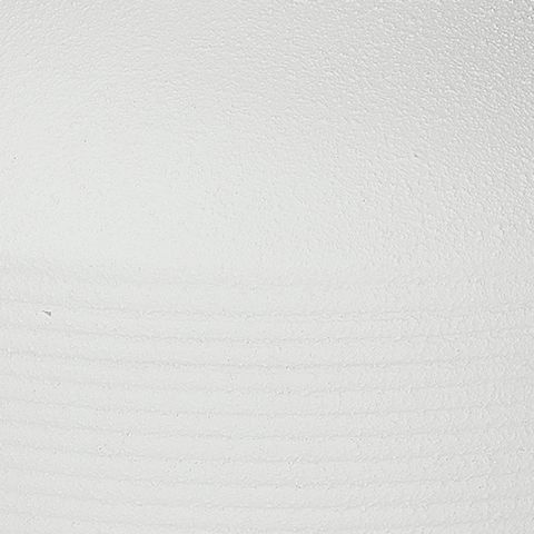 White ceramic vase surface close-up with subtle speckling