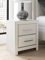 White two-drawer night stand with two silver bar handles and matching cabinet sides