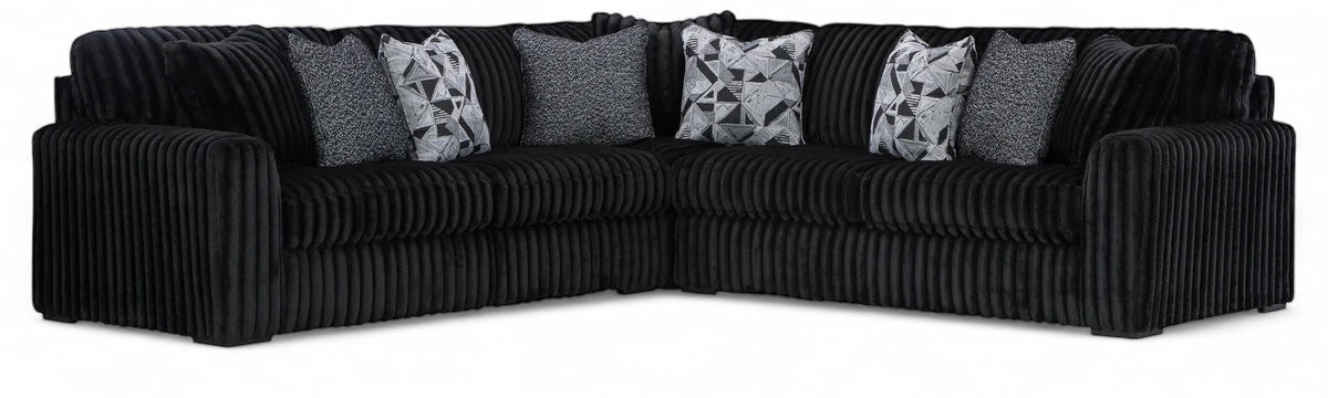 Sectional sofa with tufted arms, black corded upholstery and gray accent cushions