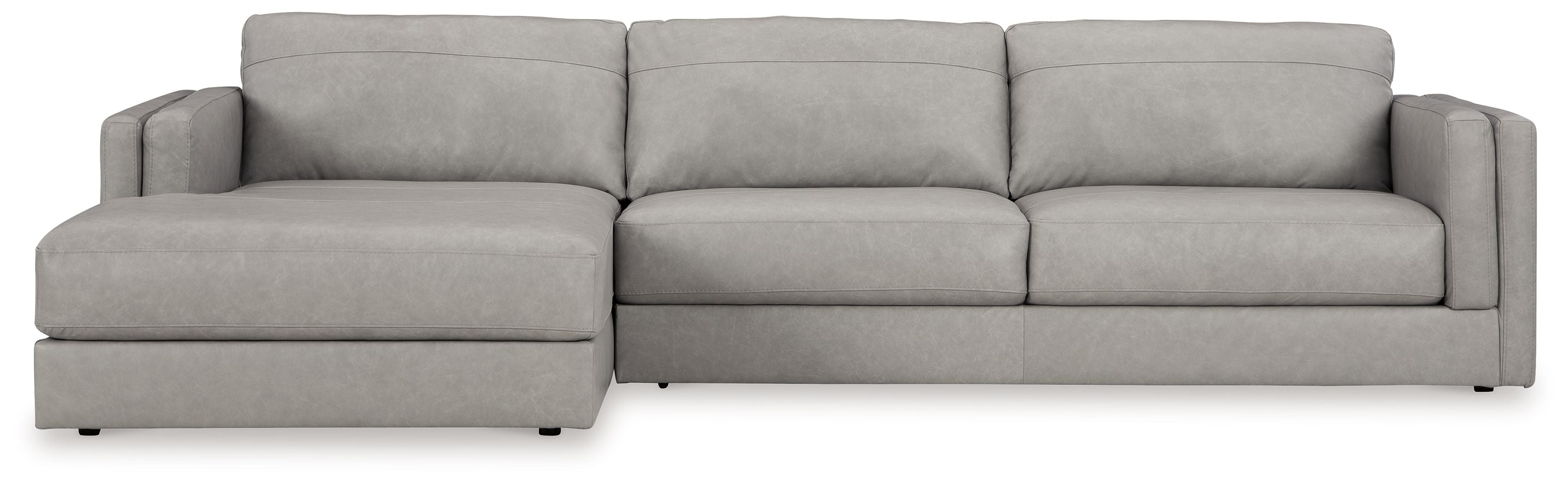 Light gray sectional sofa with chaise and three seat cushions