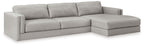 Sectional sofa with chaise lounge, light gray upholstery, multiple back cushions and arms