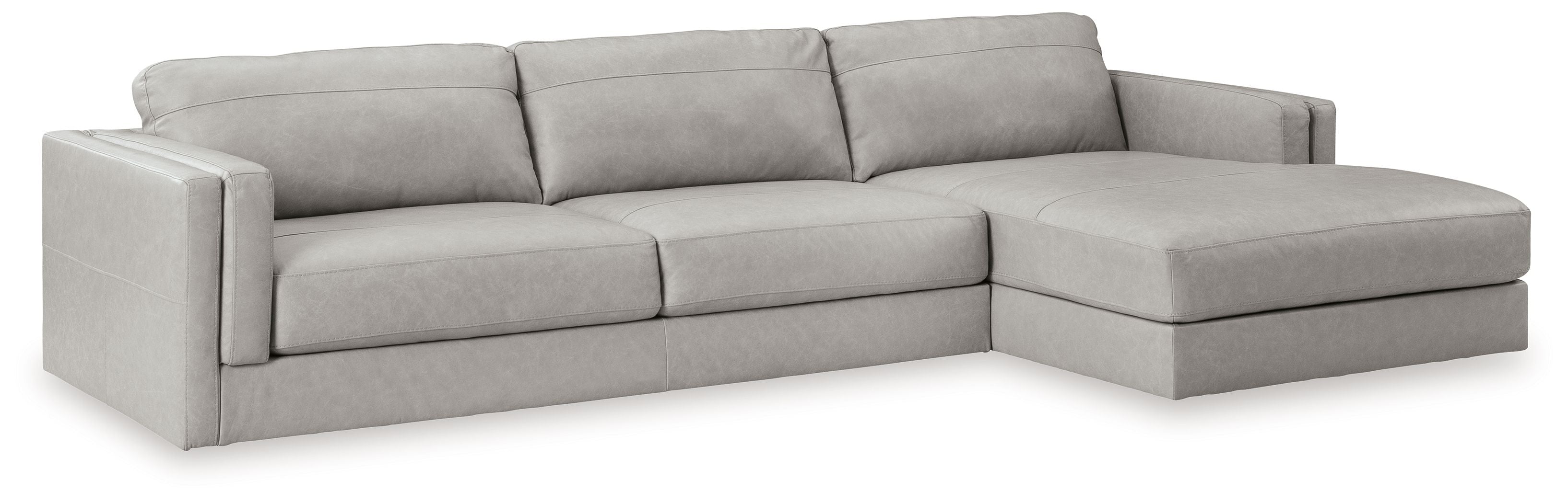 Sectional sofa with chaise lounge, light gray upholstery, multiple back cushions and arms
