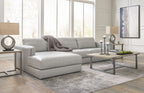 Sectional sofa with chaise lounge, light gray fabric upholstery and loose-looking throw pillow