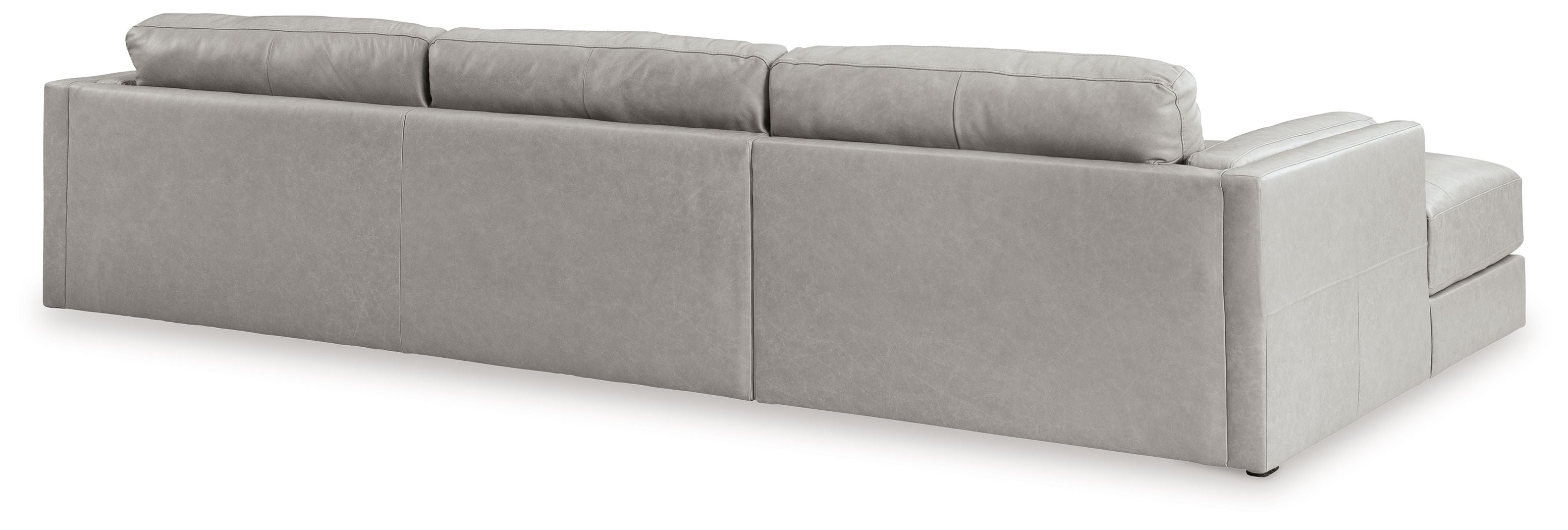 Sectional sofa with chaise lounge, light gray upholstery, clean arm and back panels